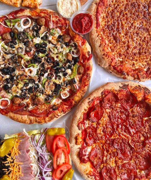 55.99 Medium Specialty Pizza, Large-2 Topping Pizza, Bread and 2 Liter Soda.